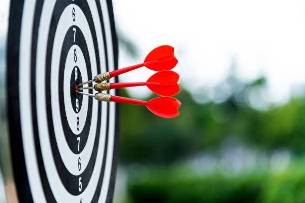istock Three darts on dart board outdoors 1186024769