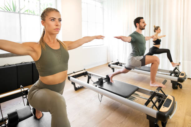 istock People working out doing yoga lunge exercises 1186025868