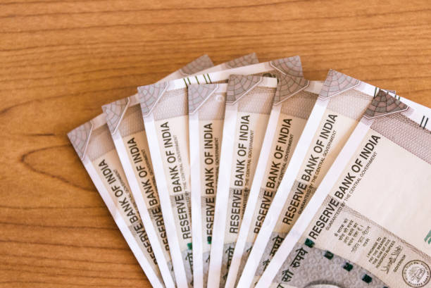 istock New series Indian five hundred rupee notes on wooden table background with copy space. 1186027145
