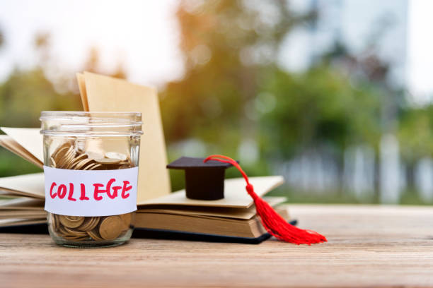 istock Coins in Jar with word COLLEGE 1186030482