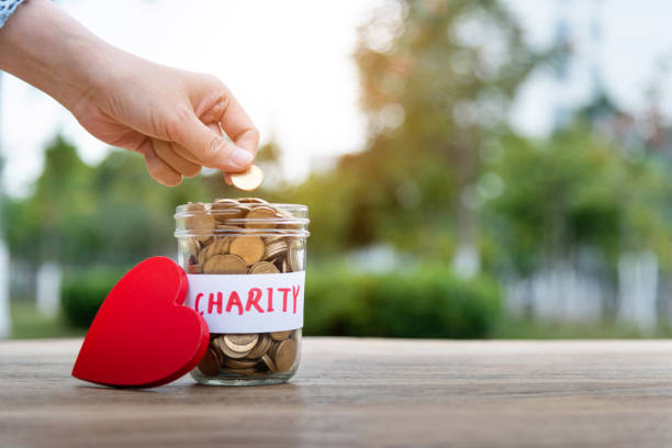 istock Saving money for charity concept 1186033010