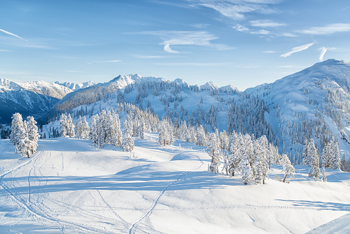 A beautiful scenery of high rocky cliffs covered with snow in the Dolomites