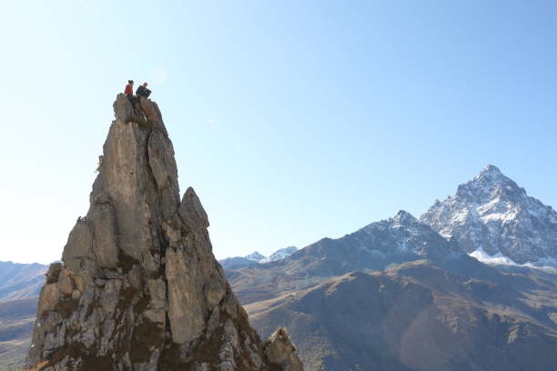 istock Mountaineers celebrate on to pinnacle summit 1186033323