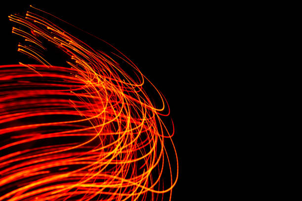 Glowing light trails - LED light painting (red) stock photo