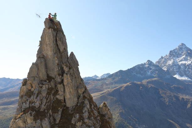 istock Mountaineers celebrate on to pinnacle summit 1186034520