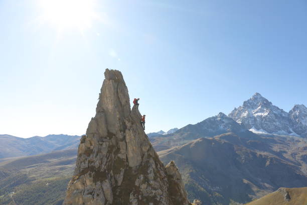 istock Mountaineers ascend to mountain summit 1186038724