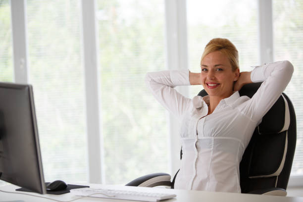 istock Businesswoman taking a break at office desk 1186039101