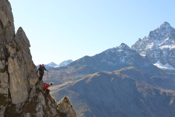 istock Mountaineers descend from mountain summit 1186040488