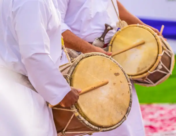 Traditional omani folk dance by using sticks, guns and music.