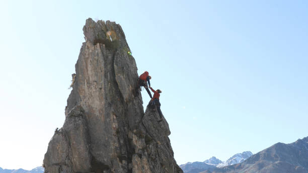 istock Mountaineers ascend to mountain summit 1186043986