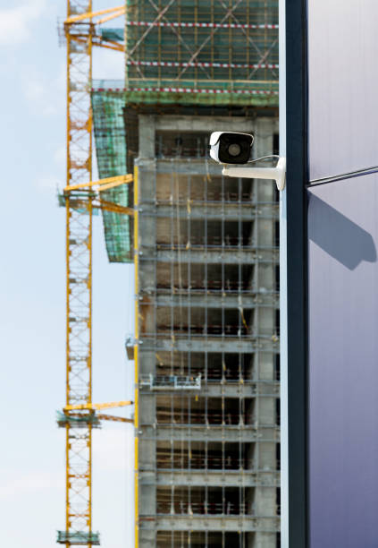 istock Security camera on the wall of modern office building 1186044613