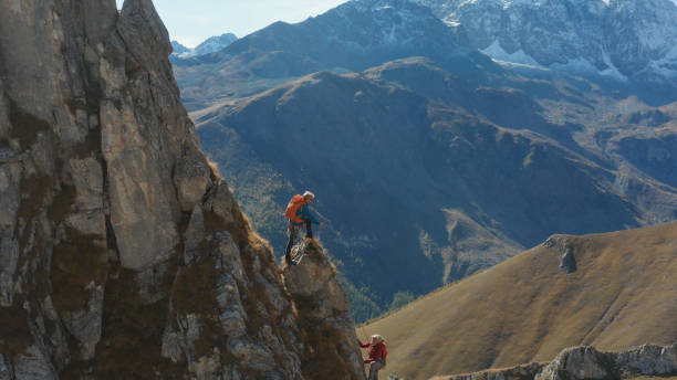 istock Mountaineers ascend to mountain summit 1186044751
