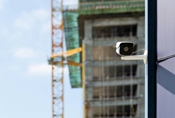 istock Security camera on the wall of modern office building 1186045765
