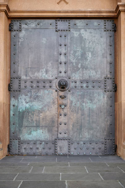 istock Old iron church door with rivets 1186048148