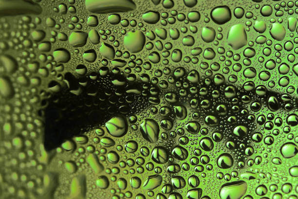 istock Water drops on glass. Green beautiful abstract background. Macro 1186051006
