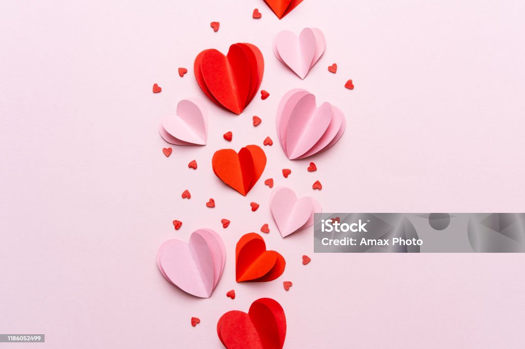 Valentine day composition with gift box and red hearts, photo template on pink background. Heart Shape Stock Photo