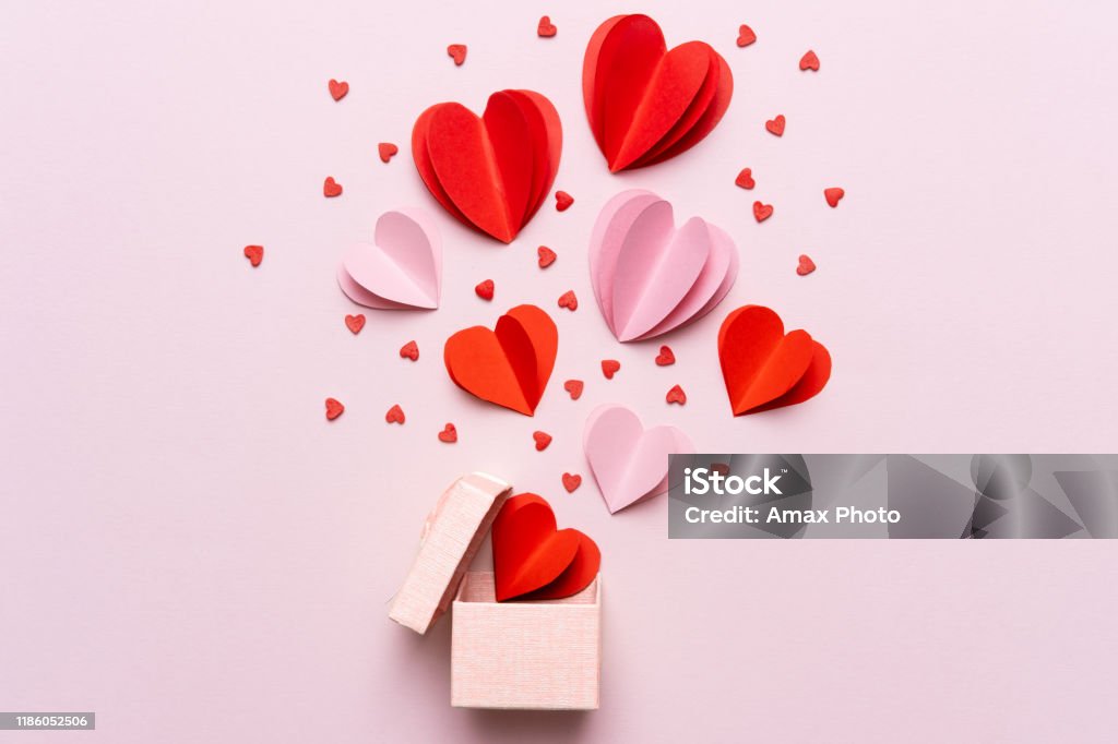 Valentine day composition with gift box and red hearts, photo template on pink background. Valentine's Day - Holiday Stock Photo