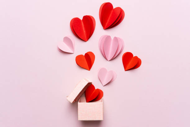 valentine day composition with gift box and red hearts, photo template on pink background. - heart shape confetti small red imagens e fotografias de stock