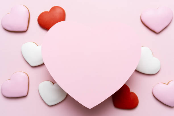istock Valentine's Day background with red hearts on pink background 1186052610