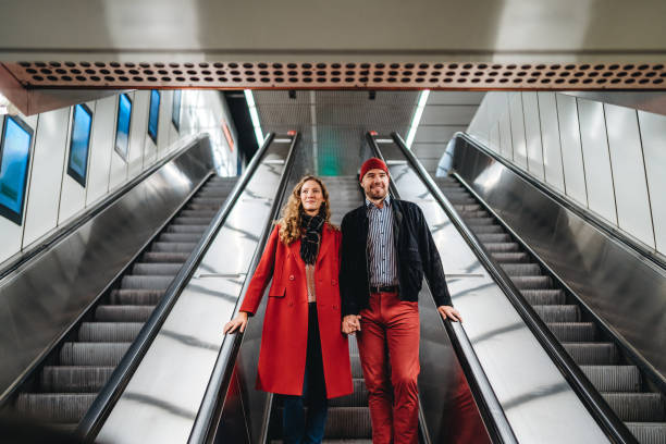 istock Couple in love on subway escalator 1186052626