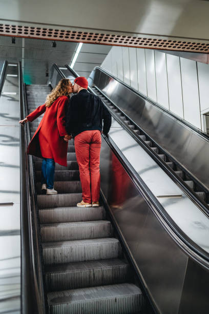 istock Couple in love on subway escalator 1186052674