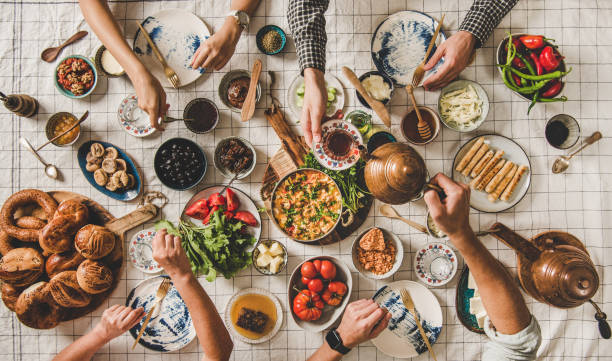 istock Flat-lay family having traditional Turkish breakfast over chekered tablecloth 1186052998