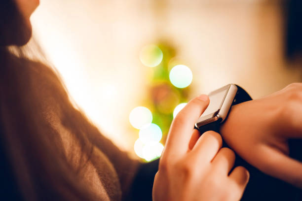 istock Woman using smart watch at home 1186061541