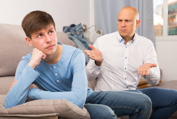 istock Man scolding his teenage son 1186061645