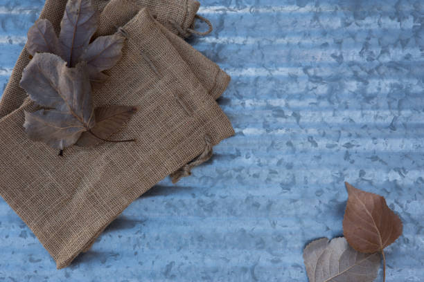 istock Leaves and burlap over metal. 1186061740