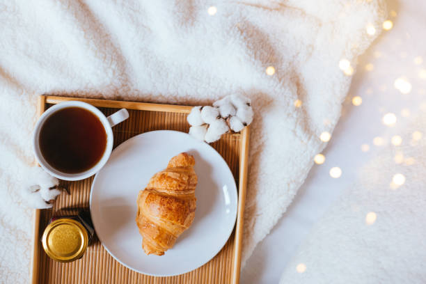 Flatlay with coffee and croissant