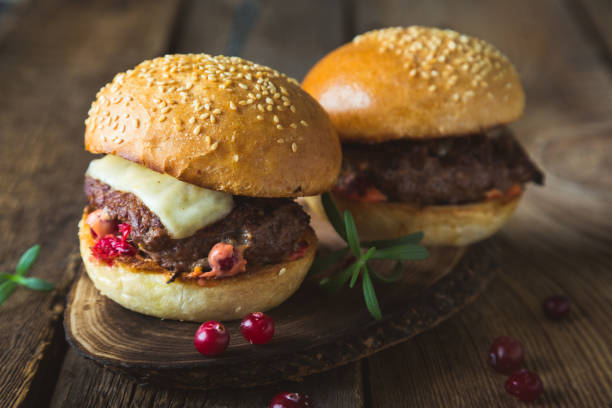 istock Big burger with cheese and cranberry sauce 1186065890
