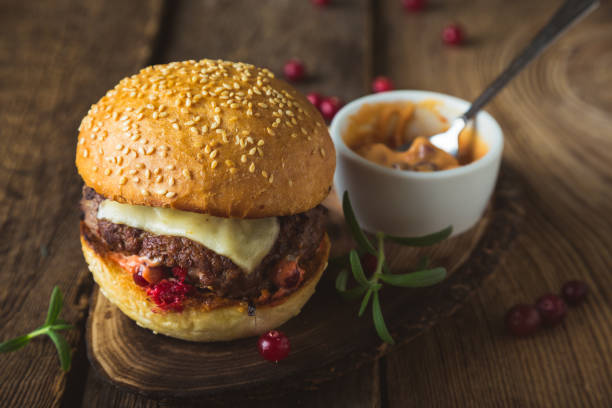 istock Big burger with cheese and cranberry sauce 1186065978