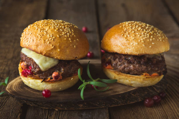 istock Big burger with cheese and cranberry sauce 1186066133