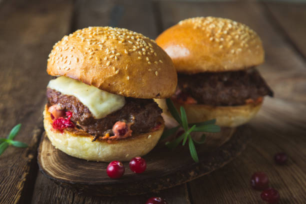 istock Big burger with cheese and cranberry sauce 1186066715