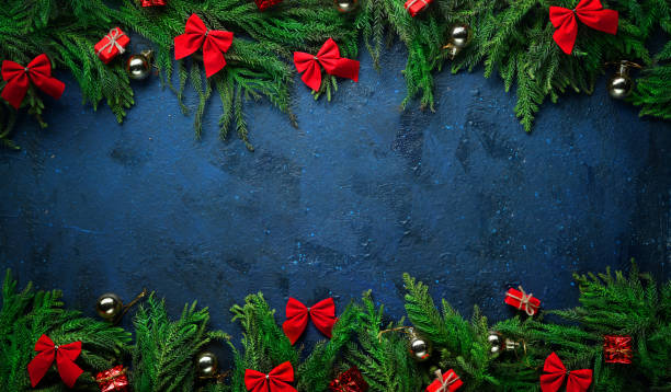 istock Christmas Tree Branches and Decoration on Top and Bottom. Banner Dark Blue Background Copy Space. 1186068671