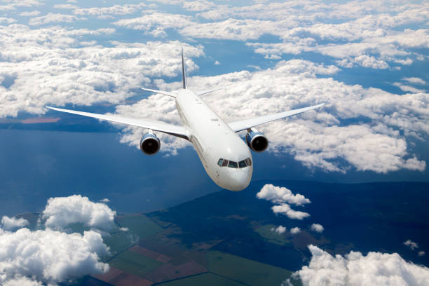 istock White modern passenger aircraft in flight 1186070927