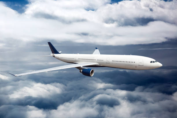 istock The passenger plane flies high between the clouds layers 1186070948