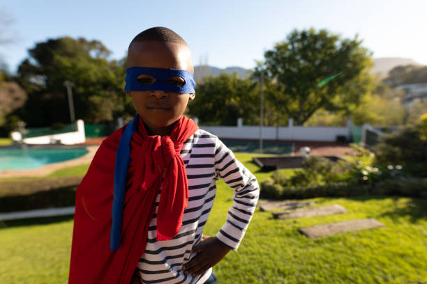 istock Superhero boy in garden 1186072196