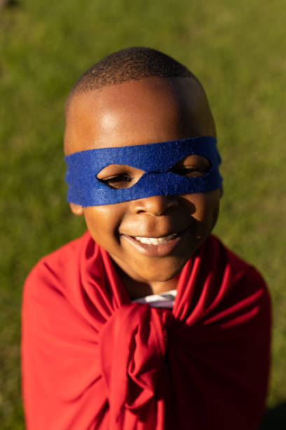 istock Superhero boy in garden 1186072238