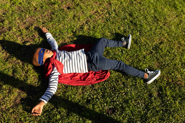 istock Superhero boy in garden 1186072331