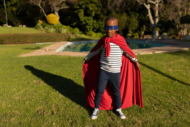 istock Superhero boy in garden 1186073037