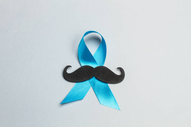 istock A black mustache and a blue ribbon 1186074250