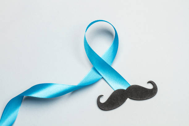 istock A black mustache and a blue ribbon 1186074819