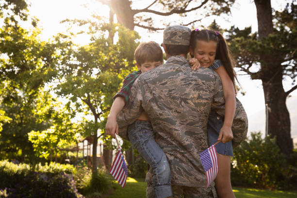 istock Soldier with kids 1186075300