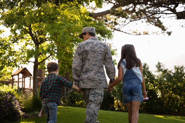 istock Soldier with kids 1186075317