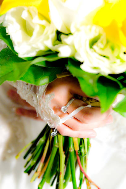 istock Wedding rings close up in flower 1186075533