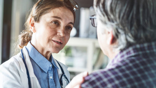 istock Doctor with patient in medical office 1186076334
