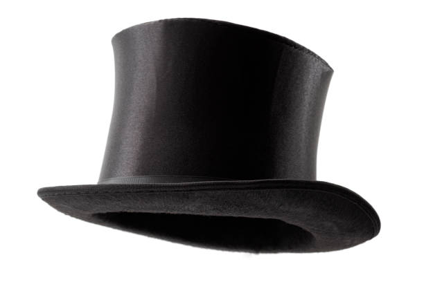 Stylish attire, vintage men fashion and magic show conceptual idea with 3/4 angle on Victorian black top hat with clipping path cutout in ghost mannequin technique isolated on white background Stylish attire, vintage men fashion and magic show conceptual idea with 3/4 angle on Victorian black top hat with clipping path cutout in ghost mannequin technique isolated on white background magician stock pictures, royalty-free photos & images