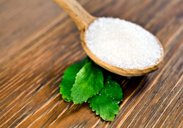 istock Stevia leaves with sugar in a wooden spoon 1186076455