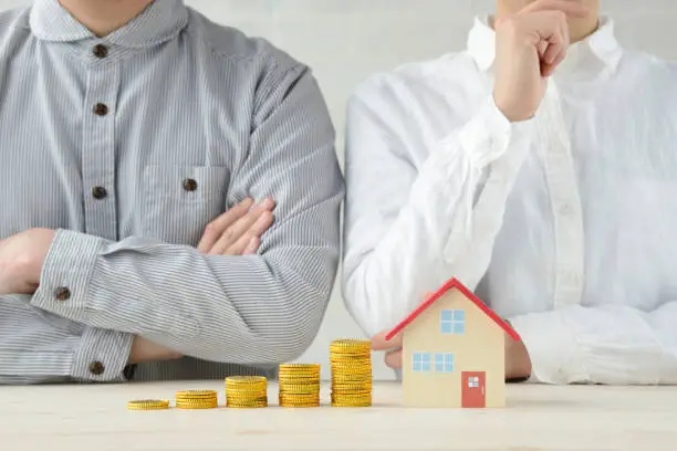 Photo of Man and woman talking about money and house problems